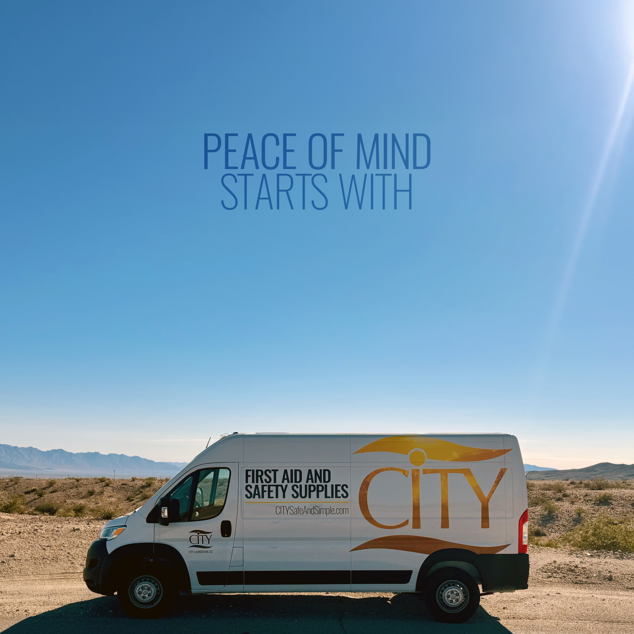 CITY First Aid and Safety Supplies van parked on a sunny open road with mountains in the background and the words “Peace of mind starts with CITY” displayed above.